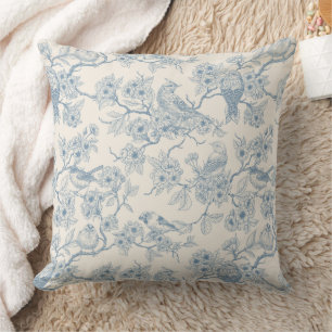 Birds and cherry blossom in blue and off white throw pillow