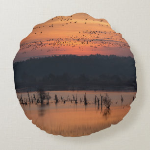 Birds at sunrise round pillow