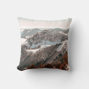 BIRD'S-EYE VIEW OF SNOW COVERED MOUNTAIN UNDER CLE THROW PILLOW
