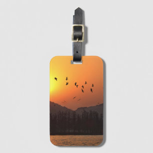 Birds Flying in Sunset Sky Over East Lake Luggage Tag