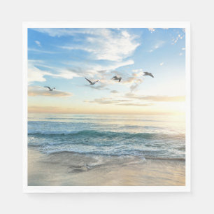 Birds in flight over the ocean napkin