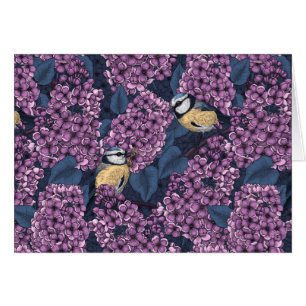 Birds in violet lilac garden