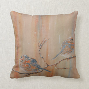 Birds on branch in snow throw pillow