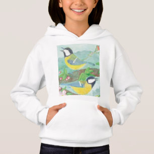 Birds singing on a blossoming tree branch 