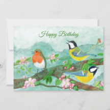 Birds singing on a blossoming tree branch 