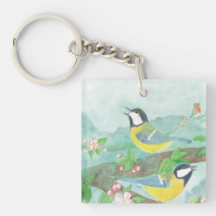 Birds singing on a blossoming tree branch keychain
