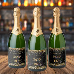 Birthday party black gold year born sparkling wine label<br><div class="desc">A black background decorated with golden confetti. The text: The name is written in dark rose gold with a large modern hand lettered style script. Personalize and add a date,  name and year of birth.</div>