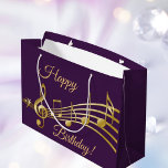 Birthday purple gold music notes large gift bag<br><div class="desc">Girly and feminine dark purple background with faux gold music notes. With the text: Happy Birthday! Golden hand lettered style script.</div>