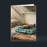 Birthday Retro Portable Record Player Card<br><div class="desc">A vintage portable record player sits on a wooden table,  surrounded by stacks of records,  as warm sunlight streams through a nearby dusty window.
All text can be changed.</div>