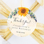 Birthday sunflower eucalyptus glitter thank you  classic round sticker<br><div class="desc">For a  40th (or any age) birthday. A white and golden watercolored background with brush strokes. Decorated with a sunflower,  green eucalyptus greenery,  faux gold foliage and glitter dust. With the text: Thank you!  Personalize and add a name,  age and a date.</div>