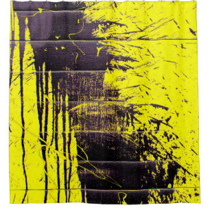 Black abstract splatter paint drips on a bright ye