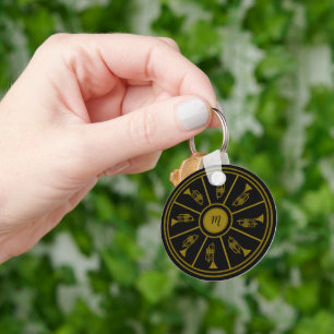 Black and gold motif with trumpets and a monogram keychain