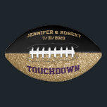 Black and Gold Wedding Custom Football<br><div class="desc">Wedding football done in a gold glitter look printed on the bottom top of the ball, with custom plum text reading Touchdown. The top half of the top of the ball, is done in solid black, with custom golden yellow text. Personalize the text with bride and groom's names, wedding date,...</div>