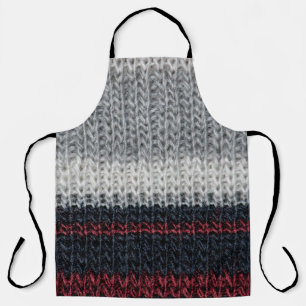 Black and grey knitting wool with red and white st apron