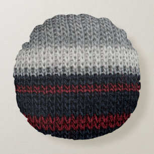 Black and grey knitting wool with red and white st round pillow