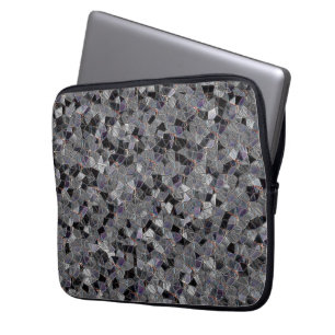 Black and grey mosaic with partially removed colou laptop sleeve