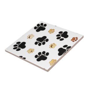 Black and tan canine dog paw print white tile