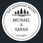 Black and white adventure wedding sticker<br><div class="desc">A simple black and white wedding sticker. The design features a simple message saying "the adventure begins" at the top with a simple illustration of a forest. Below, you can customize the design with your names or "Mr & Mrs" or a short message of thanks, with the date of your...</div>