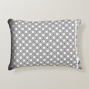 Black and white fabric design featuring intricate  accent pillow