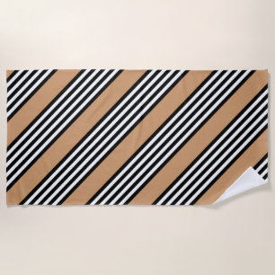 Black and white five stripe pattern with tan beach towel