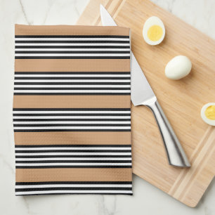 Black and white five stripe pattern with tan kitchen towel