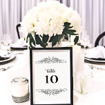 Black and White Flourish Elegance Table Number<br><div class="desc">© 2023 Socialite Designs Inc.  Elegant black flourish design with white background table number card.  Add elegance to your tables with these table number cards so that your guests can find which table they are sitting at.</div>