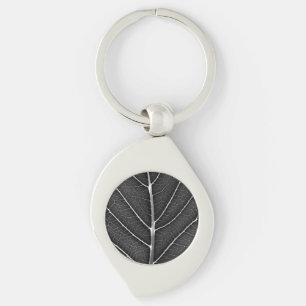 Black and white glowing leaf close-up keychain