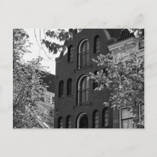 Black and white historical building in Amsterdam Postcard