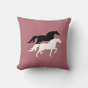 Black and white horse silhouettes on rose gold throw pillow