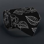 Black And White Leafy NeckTie<br><div class="desc">Elevate your evening attire with this striking black necktie,  featuring a crisp white floral and leaf motif. The high-contrast botanical print offers a fresh,  modern take on traditional floral patterns,  making it a versatile piece for weddings,  galas,  or high-stakes boardroom meetings.</div>