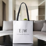 Black and White Minimalist Modern Monogram Tote Bag<br><div class="desc">Introducing our Black and White Minimalist Modern Monogram Collection: Embrace simplicity and sophistication with our minimalist designs, curated to elevate your style effortlessly. Crafted with a keen eye for modern aesthetics, this collection features sleek black and white designs accentuated by personalized monograms. From chic stationery to versatile accessories, our collection...</div>