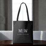 Black and White Minimalist Modern Monogram Tote Bag<br><div class="desc">Introducing our Black and White Minimalist Modern Monogram Collection: Embrace simplicity and sophistication with our minimalist designs, curated to elevate your style effortlessly. Crafted with a keen eye for modern aesthetics, this collection features sleek black and white designs accentuated by personalized monograms. From chic stationery to versatile accessories, our collection...</div>