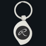 Black and White Monogram Keychain<br><div class="desc">Simple and chic, this design features a white monogram over a black background. It makes a great personalized gift. Edit the monogram with your initial. You can adjust the font and re-centre it to suit your monogram by using the "Customize It" feature. You can also change the black background to...</div>