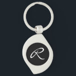 Black and White Monogram Keychain<br><div class="desc">Simple and chic, this design features a white monogram over a black background. It makes a great personalized gift. Edit the monogram with your initial. You can adjust the font and re-centre it to suit your monogram by using the "Customize It" feature. You can also change the black background to...</div>