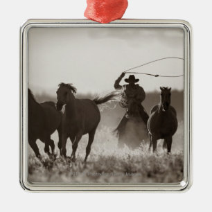 Black and White photo of a Cowboy Lassoing Horses Metal Ornament