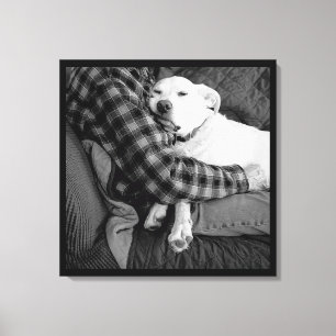 Black and White Photo of Dog Snuggling with Dad Canvas Print
