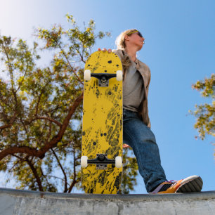 Black and Yellow Paint Splashes Skateboard