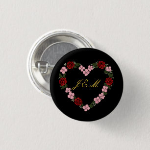 Black badge with a pink and red heart 1 inch round button