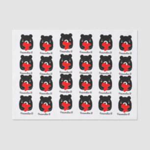 Black bear holding a heart tissue paper