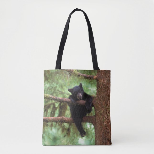 black bear, Ursus americanus, cub in a tree Tote Bag (Front)