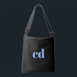 Black blue monogram initials elegant modern crossbody bag<br><div class="desc">A classic chic black background. Personalize and add your monogram initials written with light blue block letters. Modern,  trendy and simple.</div>