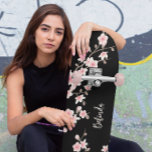 Black BLUSH Pink Cherry Blossom Monogram  Skateboard<br><div class="desc">Stand out at the skatepark with this beautifully designed skateboard featuring soft pink cherry blossoms on a deep black background. This custom deck adds a delicate, feminine flair to bold street style – perfect for skaters who want to express strength and grace. Personalize it with your name for a one-of-a-kind...</div>
