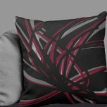 Black & Burgundy Artistic Abstract Ribbons Throw Pillow<br><div class="desc">Black and burgundy throw pillow features an artistic abstract ribbon composition with shades of burgundy and wine with white accents on a black background. This abstract composition is built on combinations of repeated ribbons, which are overlapped and interlaced to form an intricate and complex abstract pattern. The black, burgundy, white...</div>