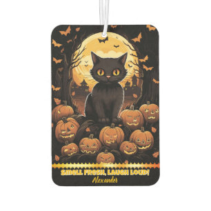 Black cat among glowing pumpkins at dusk air freshener