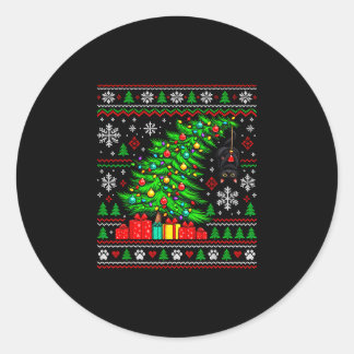 Black cat hanging from christmas tree festive pet classic round sticker