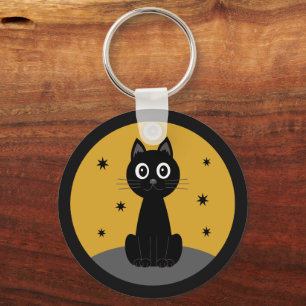 Black cat sitting watching the stars keychain