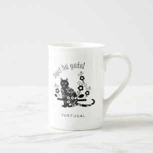 Black cat with flowers and Portuguese expression Bone China Mug