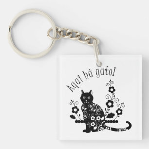 Black cat with flowers and Portuguese expression Keychain