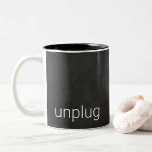 Black chalkboard with word "unplug" Two-Tone coffee mug