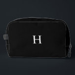 Black Classic Elegant Monogram Toiletry Dopp Kit<br><div class="desc">This Classic Elegant Modern Minimalist Black and White Monogram Initial combines timeless sophistication with a modern twist. Featuring a sleek black and white color scheme, it highlights a personalized monogram for a unique, custom touch. Perfect for elevated events, this exudes chic and classy elegance. Personalize it for your home, wedding,...</div>